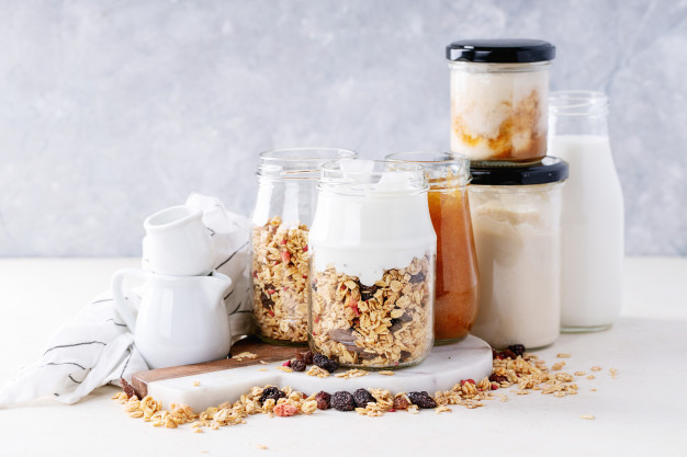 Yogurt for breakfast with fruit and cereal is a great way to start the day.